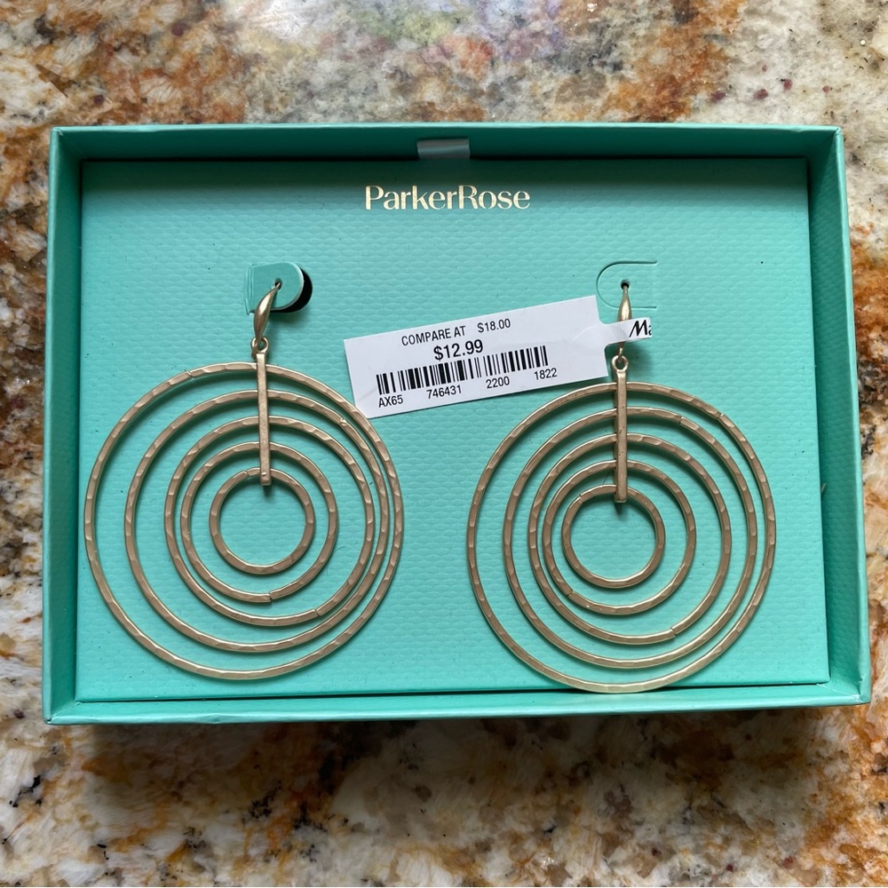 Matte gold metal earrings by Parker Rose